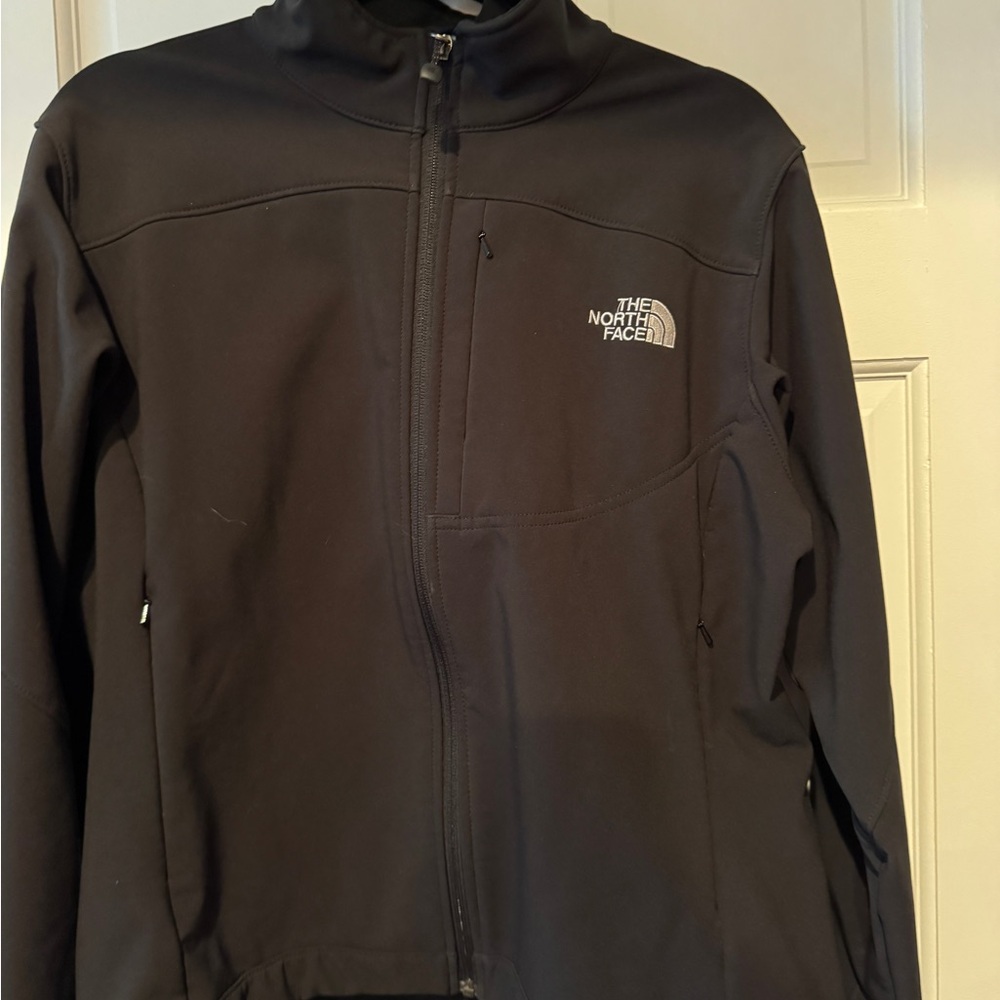 The North Face woman’s black soft shell jacket. Size L